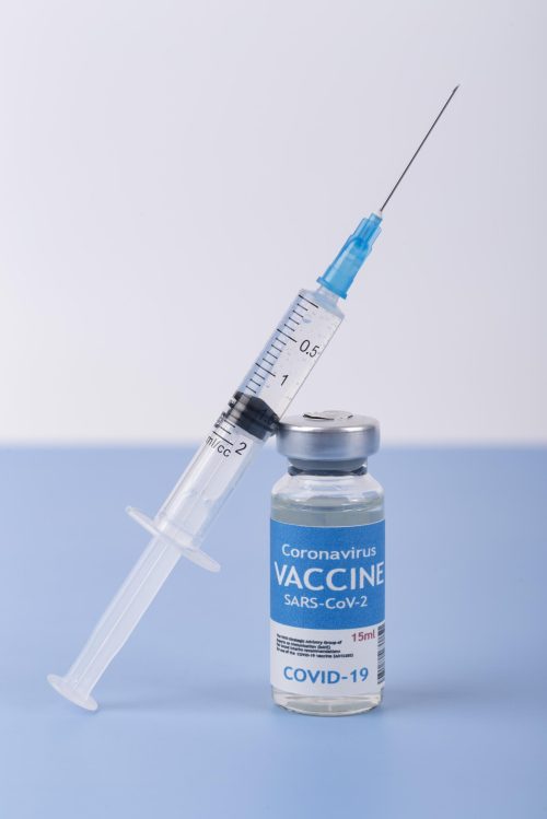 coronavirus-arrangement-with-vaccine-bottle-syringe Vaccine